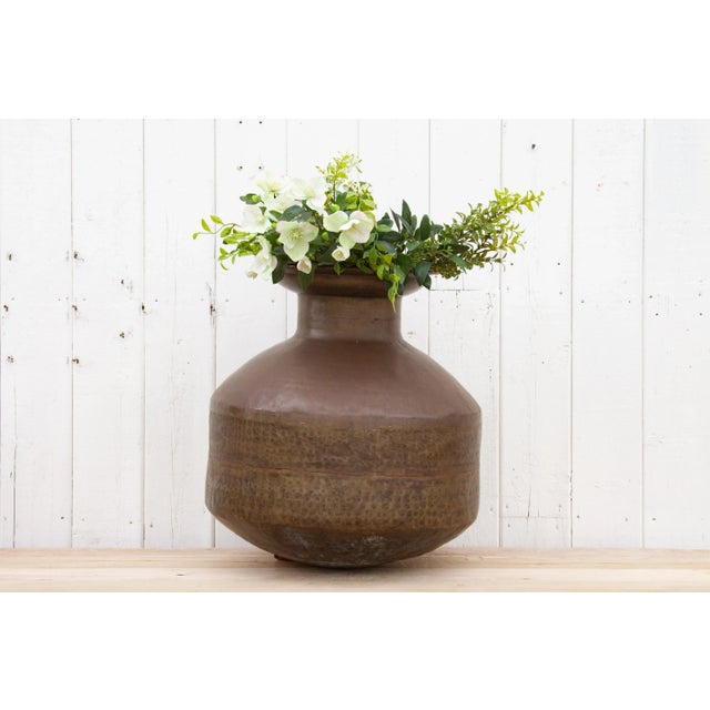This gorgeous antique Indian brass planter is a perfect addition to any space, combining a unique antique rustic aesthetic...