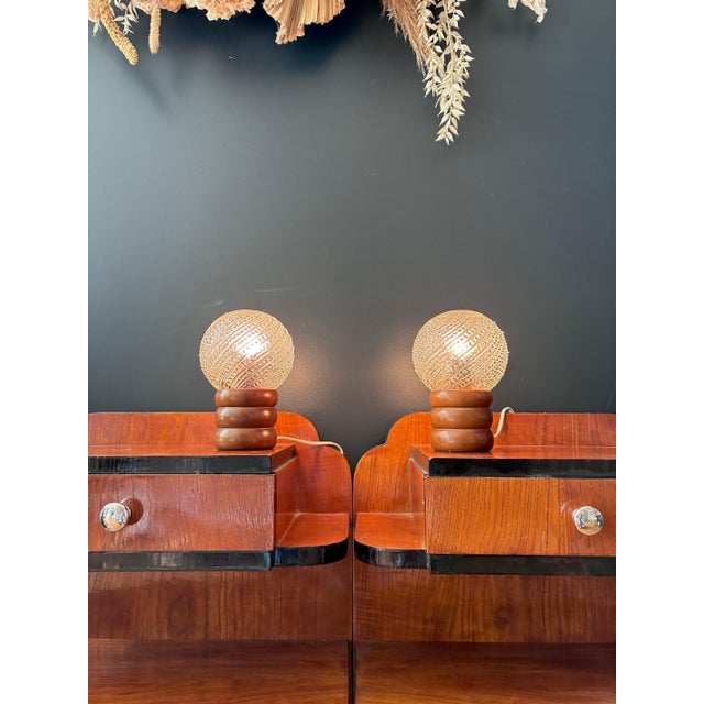 Turned wood legs and cut glass globes. 1970s. Excellent condition. Electrical connection checked and fully functional....