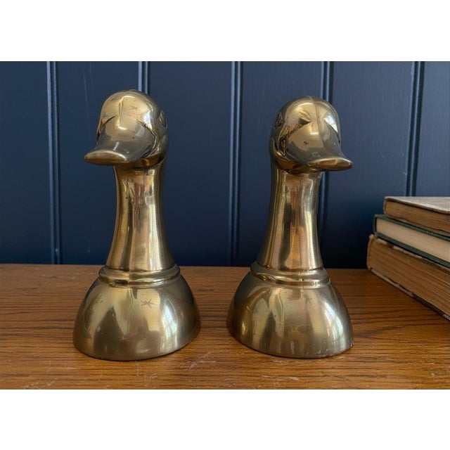 A handsome pair of cast brass mallard duck head bookends retailed by Horchow, the Dallas-based luxury catalog that...