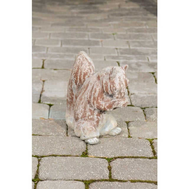 An English painted lead animal sculpture of a squirrel from the first half of the 20th century. This sculpture features a...