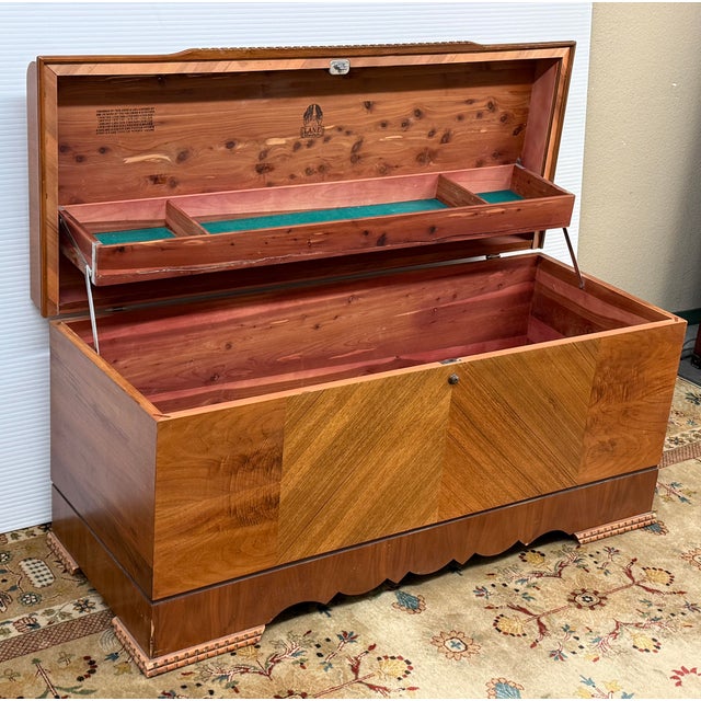 Design Plus Gallery presents a Vintage Waterfall Cedar Chest from Lane Furniture. The curved waterfall lid is accented by...