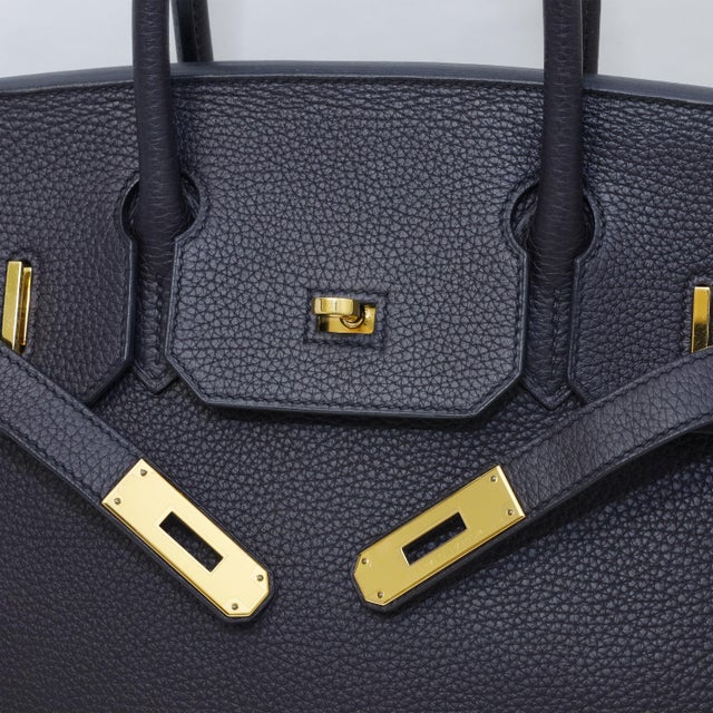 Black is the least forgiving finish on a Birkin. It hides nothing — every scuff, every slack seam, every softened corner...