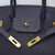 Black is the least forgiving finish on a Birkin. It hides nothing — every scuff, every slack seam, every softened corner...