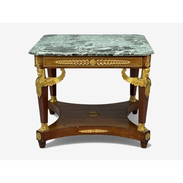 Empire Revival, Gilt Bronze, Mahogany, Marble, Center Table, France, 19th c. A finely cast Napoleon lll Arm Center Table....