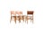 This set of four mid-century Danish dining chairs features backrests in teak and frames in solid beech. The chairs are...
