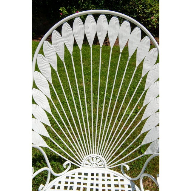 Stunning and unique iron garden set. Two over-the-top gorgeous "feather" arm chairs with a "flower power" and lattice...