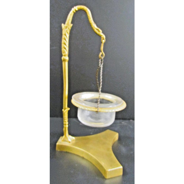 This 1870s French Empire gilded bronze stylized swan night light tallow lamp is a charming piece of antique French...