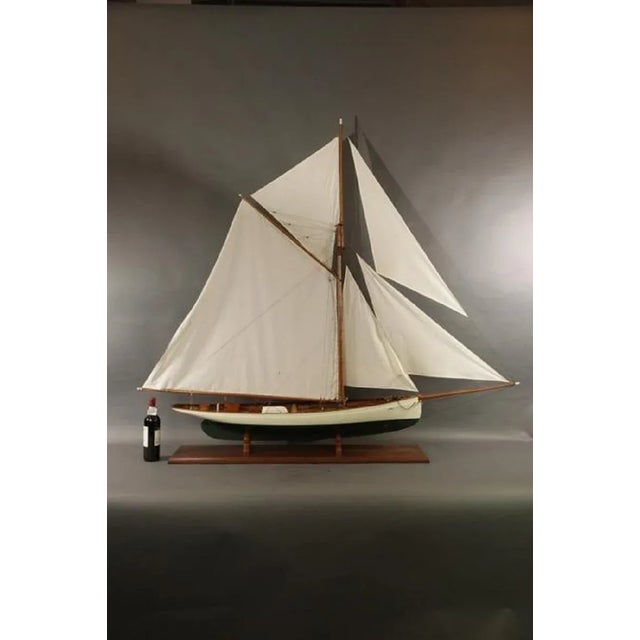 Six foot model of the Boston built America's Cup yacht Puritan. Fine model with planked deck, skylights with brass bars,...