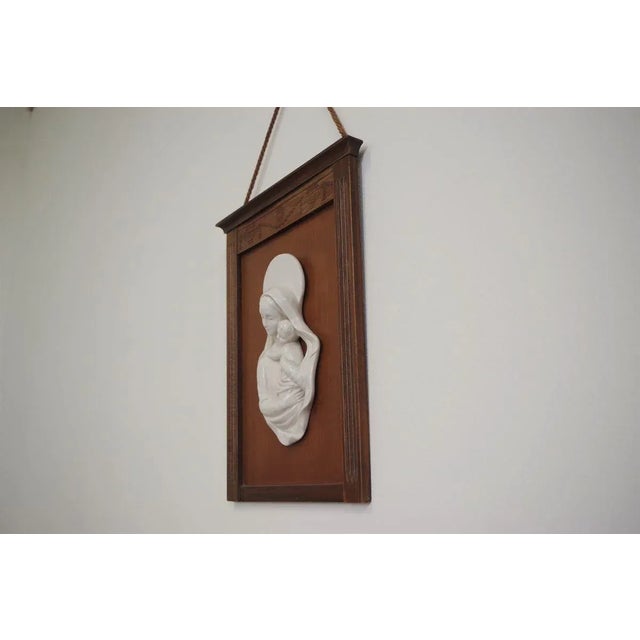 Carved wooden frame with Madonna in ceramic, 50s.