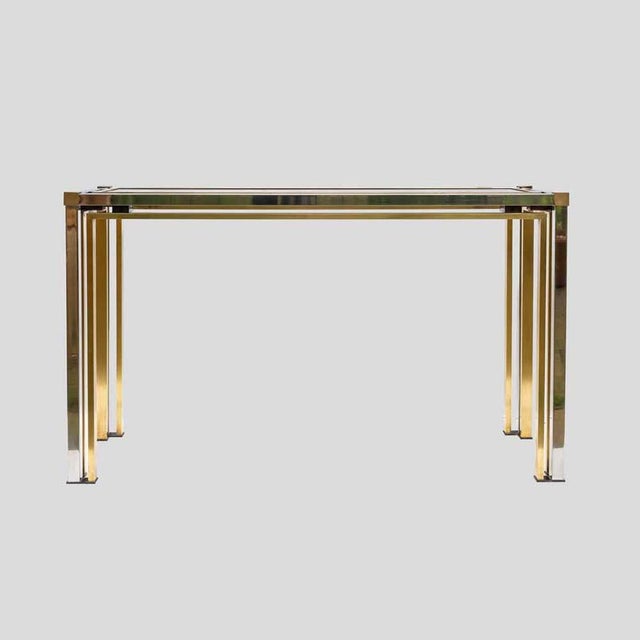 Brass and Chrome metal console table. Console table vintage chrome and brass structure with original smoke-colored glass...