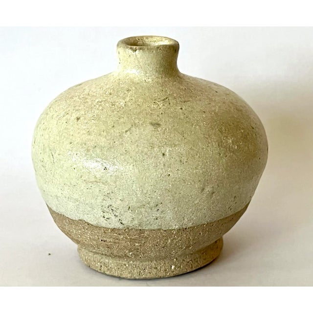 A original antique Chinese Stoneware with white glaze (Cizhou ware) jar let from the Song Dynasty (960-1279) Measuring...