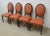 Set of 4 Dining Chairs by E J Victor. They feature a nailhead trim and oval back rest.