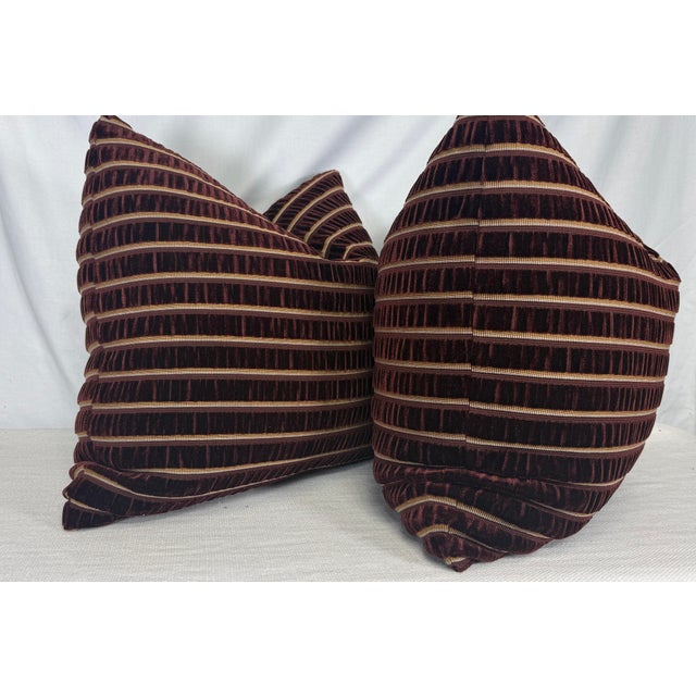 Custom pair of 22" pillows covered in Osborne & Little "Celesta Stripe" in color plum cut velvet. These pillows have...