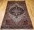 "This early 20th-century Farahan Sarouk area rug features a majestic medallion floral design in a rich palette of navy...