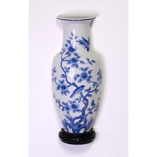 Fine Japanese white porcelain wall pocket vase with blue & white floral decoration depicting perched and flying birds on...