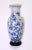 Fine Japanese white porcelain wall pocket vase with blue & white floral decoration depicting perched and flying birds on...