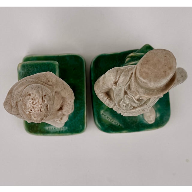 A charming set Bretby Art Pottery figures depicting Mr. Micawber and Uriah Heep from Charles Dickens' David Copperfield,...