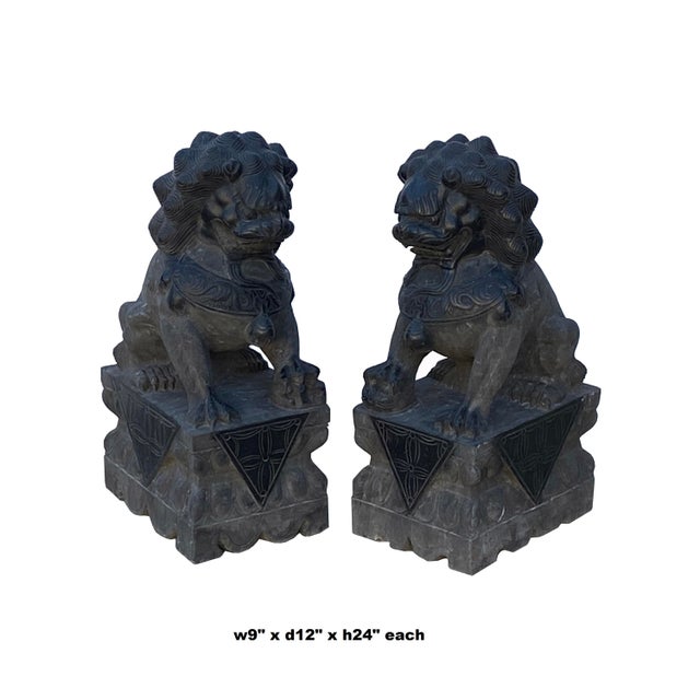 Elevate your property's aesthetic and spiritual harmony with this majestic pair of authentic hand-carved gray stone...