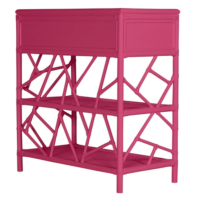 In a whimsical, geometric pattern, this beautiful and functional end table is constructed with a Rattan frame and rawhide...