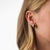 These striking vintage hoop earrings showcase two beautifully polished cabochon cut emeralds totaling approximately 4.70...
