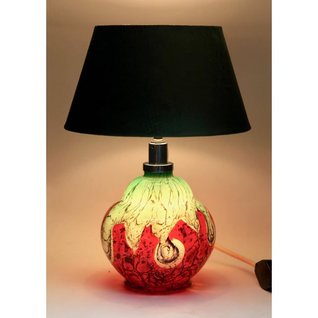 This table lamp was designed by karl wiedmann in the 1930s and manufactured by wmf ikora in the 1950s. The lamp is made of...