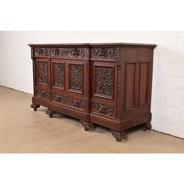 An exceptional antique Victorian or Renaissance Revival sideboard, credenza, or bar cabinet Attributed to R.J. Horner &...