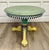 Here is a charming vintage hand-painted accent table in the style of Mackenzie-Childs, featuring colorful floral...