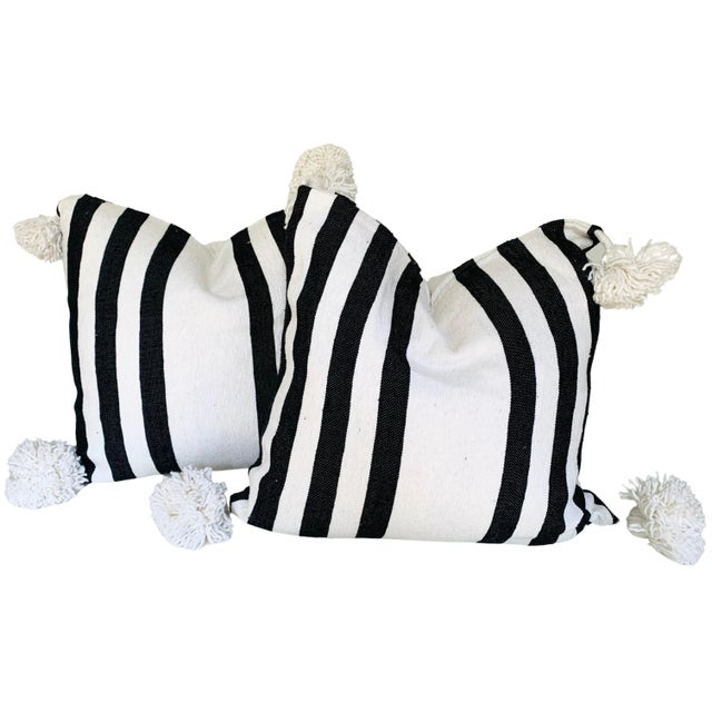 Pair of Moroccan handloomed cotton pom pom pillows with zipper closure New duck feather-and-down fill inserts. Pattern on...