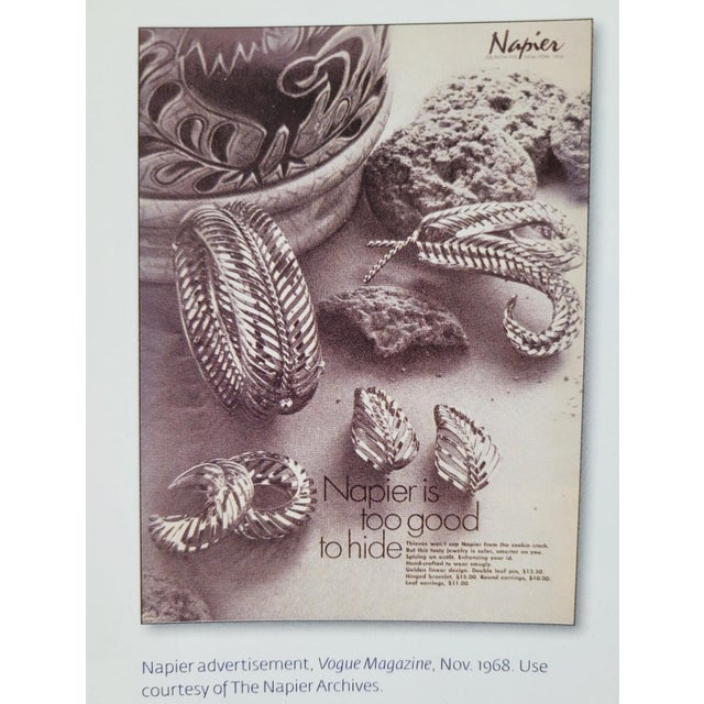 1968 goldtone offset slatted hoop clip earrings. Marked "NAPIER©" on the clips. Measure: 1 1/4 inches long by 1/2 inch...