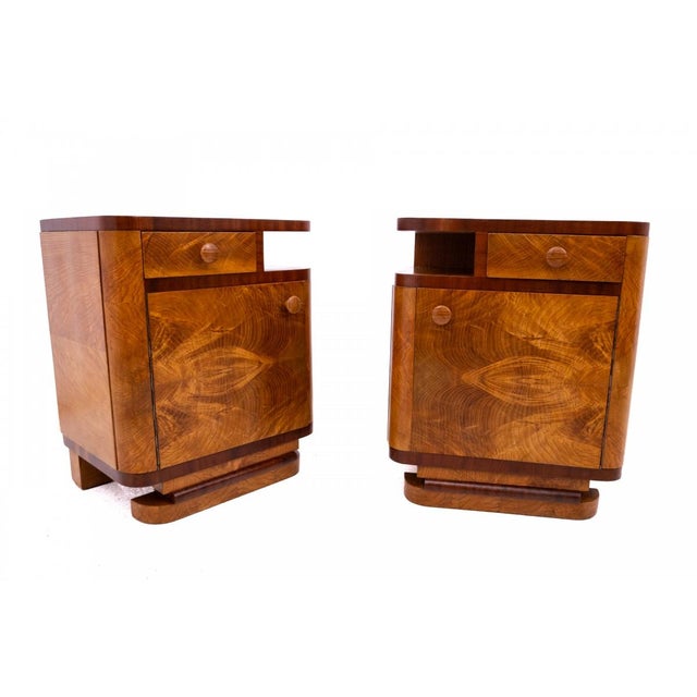 A pair of Art Deco bedside tables from the 1950s, Poland. The furniture is in very good condition, after professional...