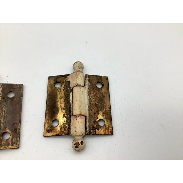 A lovely small set of two bronze eastlake style cabinet hinges with complete cannonball finials. The bronze hinges are in...