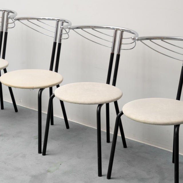 Set of six chairs. Metal frame. Chromed backrest. Light fabric seat. Item in good condition, with very minor signs of...