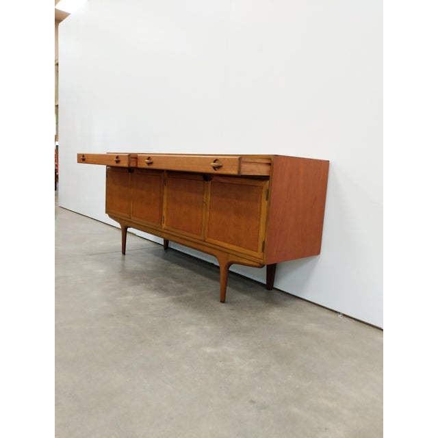Authentic vintage mid century modern teak credenza / sideboard / console. By Greaves and Thomas. Maker's label on back....