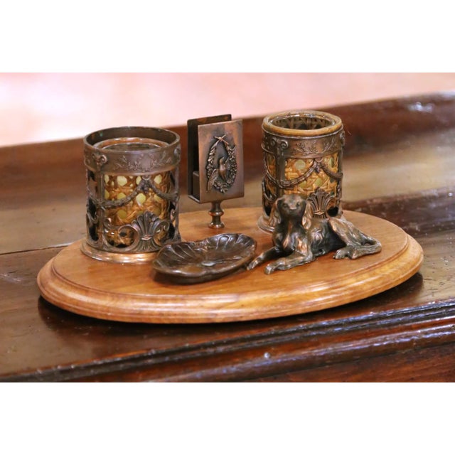 Decorate a desk or study with this charming antique desk accessory set crafted in France, circa 1920. Mounted on a rich...