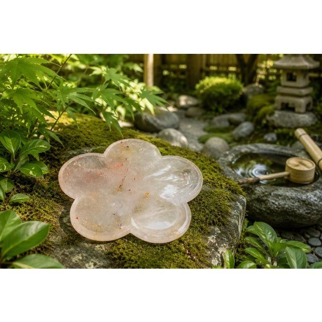 An exquisite natural rock crystal plate, hand crafted in Japan in the graceful form of a five-petal peach blossom, a...
