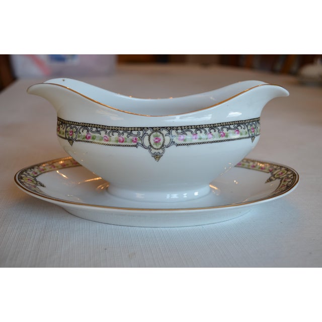 Attached Gravy boat and plate from Paul Muller Selb, Bavarian china. The hand painted piece is trimmed in black and gold...