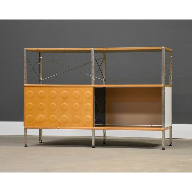 A mid century modern designed maple top sideboard credenza designed by Charles and Ray Eames for Herman Miller with a...