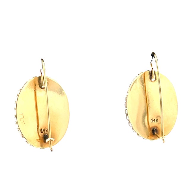 Beautiful vintage portrait earrings crafted in 14k yellow gold, featuring delicately lady portraits set under oval glass....