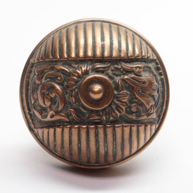 This Italian Renaissance style asymmetrical bronze entry door knobs were made by Reading in the 1890 catalog. It is part...