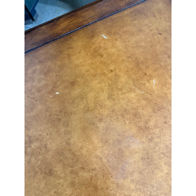 A beautiful English imported writing desk featuring dark wood, barely twist legs and stretchers with a leather. Brass...