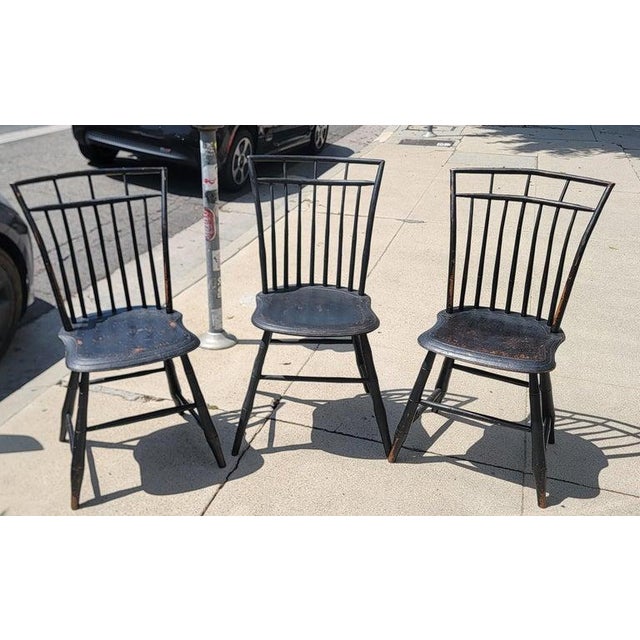 Collection of three original black painted 19thc American Birdcage Windsor chairs. Hand made construction original black...