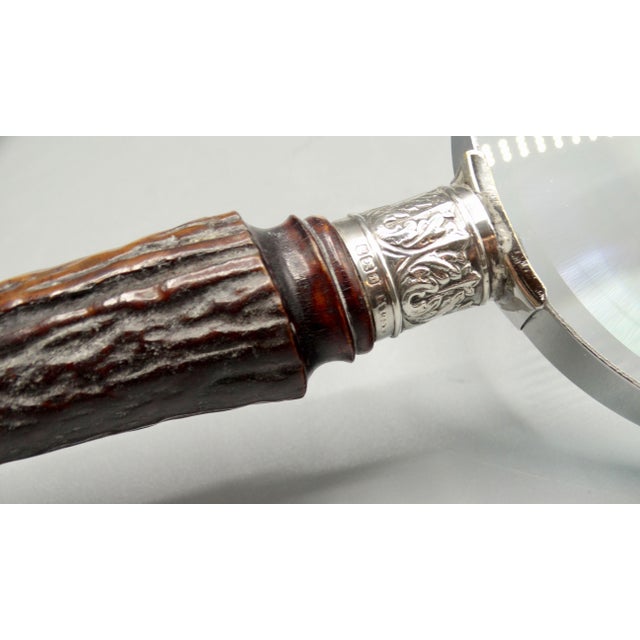 A fine quality antique English natural stag horn handled magnifying glass with sterling silver mounts. Maker is Henry...