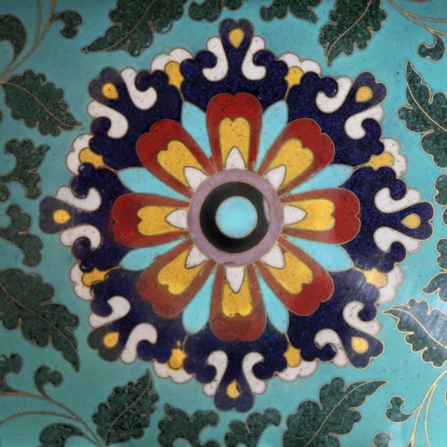 This vintage Chinese coffee table features an ebonized finish, richly polychromed with traditional motifs. The tabletop is...