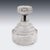 An elegant Art Deco decanter combining finely cut crystal with a silver mounted collar. The decanter features strong...