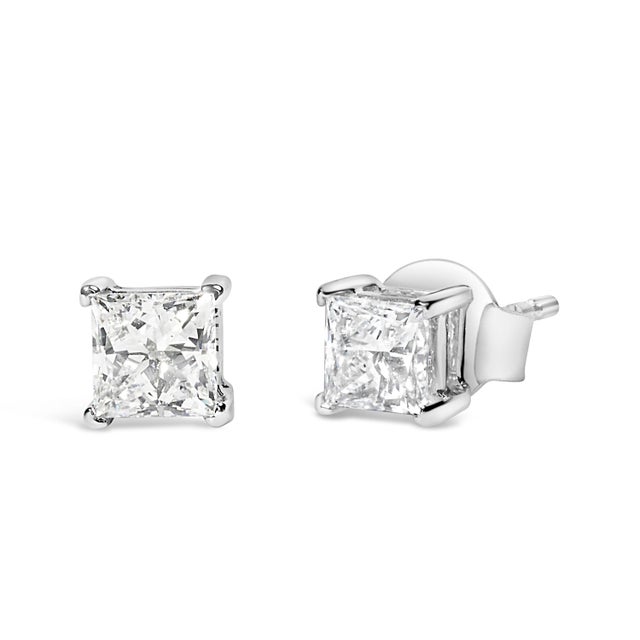 Embrace timeless elegance and modern sophistication with these exquisite 14K white gold solitaire stud earrings. Each...