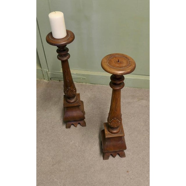 A Pair of Tall Gothic Turned and Carved Wooden Candle Sticks This is a Tall pair of table candle sticks, they are 23” high...