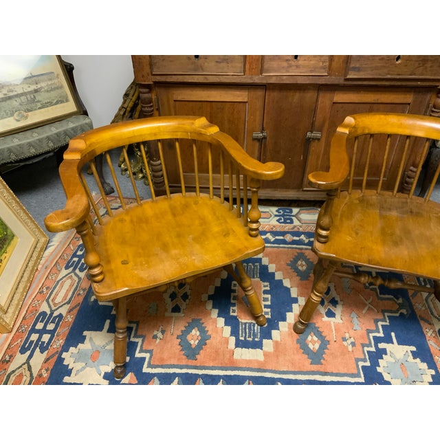20th Century pair of Ethan Allen captain chairs. Deep saddle seats for comfort.
