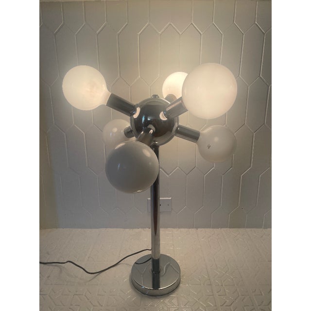 Original 1960's - 1970's Robert Sonneman table lamp. Six 5-inch globes. Chrome construction. Stands approximately 29" tall...