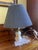 This is a charming vintage-style electric table lamp featuring a pleated blue lampshade with a subtle dotted pattern. The...