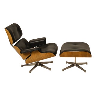 Set of Lounge Chair and Ottoman in Walnut and Black Leather by Charles Eames for Herman Miller, 1990s For Sale